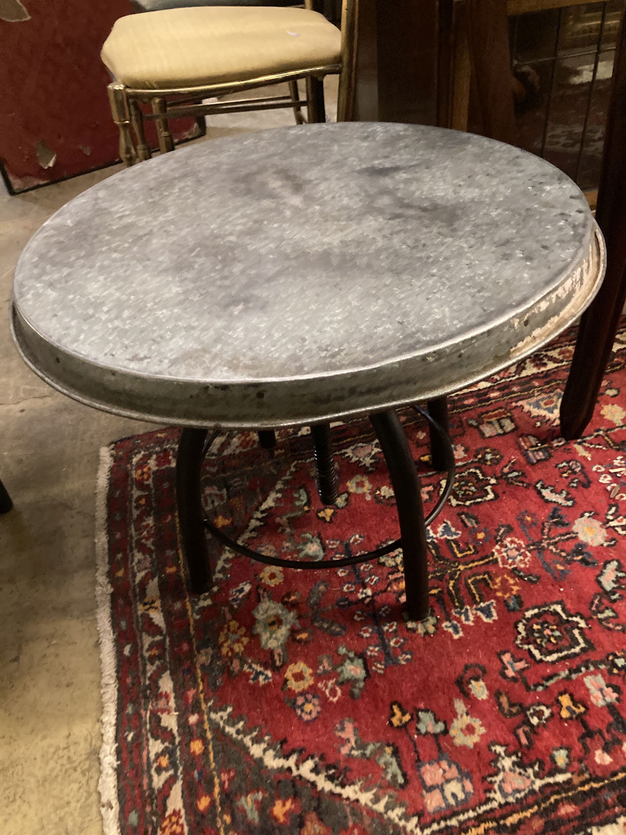 Two industrial style circular metal occasional tables, 54cm diameter, height 44cm